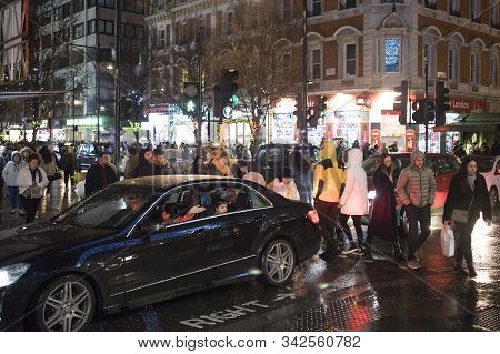 Busy London Street Scene At Oxford Circus With British Flags Decorating Regent Street, A Landmark Re
