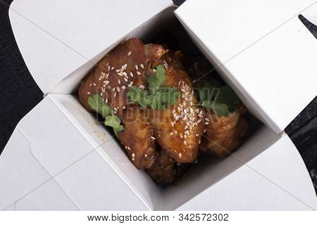 Chicken In Sweet And Sour Sauce With Sesame Seeds In Take Away Boxes, Flat Lay