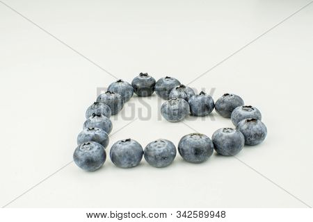 Fresh Tasty Blueberry Heart Shapeon White Background