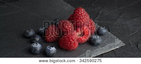 Fresh Tasty Blueberry And Raspberry On White Background