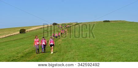 Alciston, East Sussex, England - September 01, 2018 : Race For Life Lady Walkers On The South Downs.