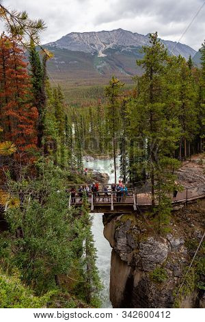 Sunwapta Falls, Jasper National Park, Alberta, Canada - August 15, 2019: People Enjoying A View From