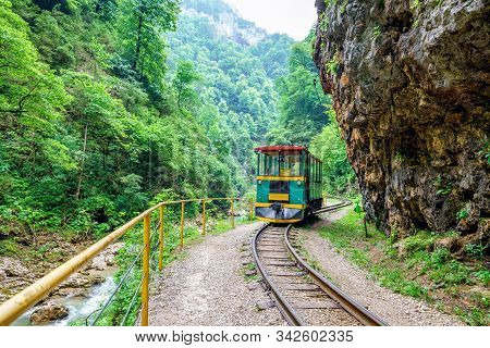 Guamka, Russia - June 28, 2016: Train Runs On Narrow-gauge Railway In Guam River Canyon Which Is Pop