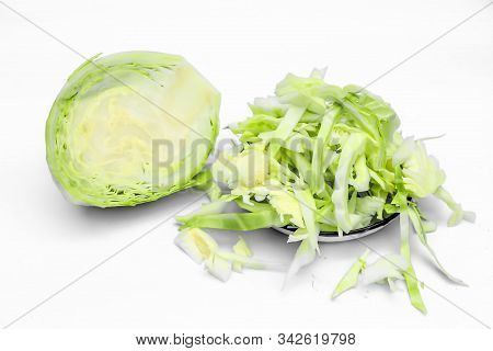 Raw Fresh Cabbage Isolated On White Along With Cut Chopped Cabbage In A Glass Plate. Horizontal Shot