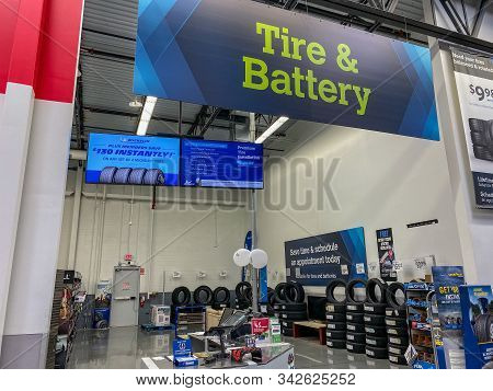Orlando,fl/usa -11/16/19:  The Tire And Battery Aisle Of A Sams Club Wholesale Retail Store With A V