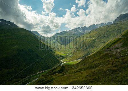 The Furka Pass  is a high mountain pass in the Swiss Alps connecting Gletsch, Valais with Realp, Uri. The Furka Oberalp Bahn line through the Furka Tunnel