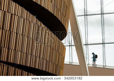 Oslo, Norway - August 11, 2019: Silhouette Of Visitor In Opera House In Oslo. Interior View. Modern 