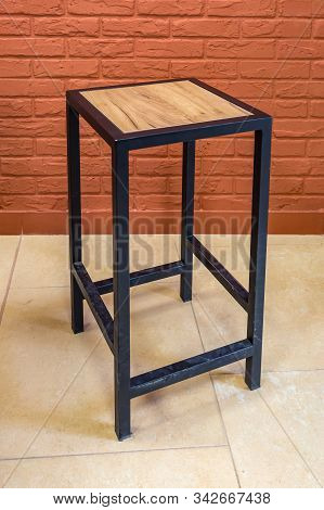Loft Wooden Stool Furniture On Brick Wall Background