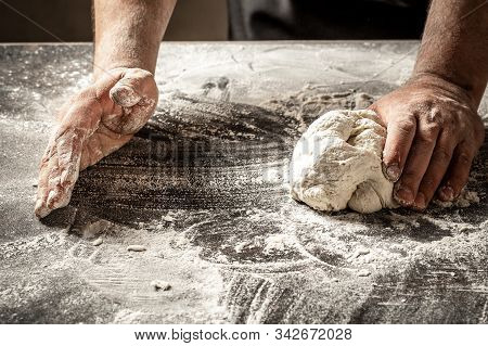 Male Hands Making Dough For Pizza, Dumplings Or Bread. Baking Concept. Chef With Raw Dough.