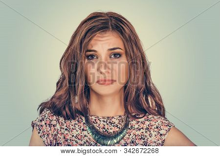 Woman Looking Sad Uspet At You Camera. Mixed Race Model Isolated On Light Green Background With Copy