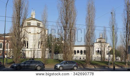 Milan, Italy - January 01, 2020: Exterior Of Cimitero Monumentale Of Milano In Milan; Cars Passing B