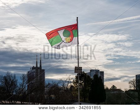 Augsburg, Germany - December 15, 2019: Illuminated Flag Of The Soccer Club Fc Augsburg Flatters In T