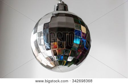 Disco Ball Hanging On Chainlet Isolated On White.