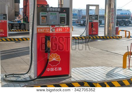 Xian, China - December 29, 2019: Chinese Petrol Station Supplying Gasoline For Refueling A Car With