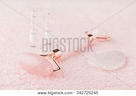 Real Rose Quartz Facial Roller, Gua Sha Massage Stone And Face Serum In Ampoules, Selective Focus