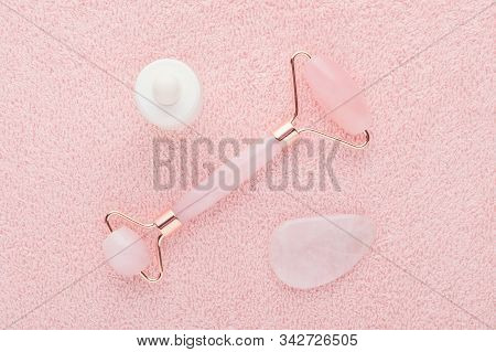 Rose Quartz Facial Roller, Massage Stone And Face Serum, Flat Lay