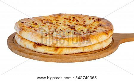 Georgian Traditional Food Khachapuri On A Wooden Dish On White Background.