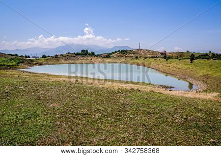 Small Water Reservoir In Village Of Albanian Mountains Near Kukes, Albania