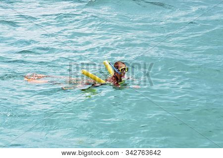 Yeppoon, Queensland, Australia - December 2019: Young Female Caucasian Child Snorkeling In The Water
