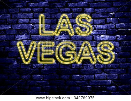Neon Style Las Vagas Sign On A Blue Brick Background