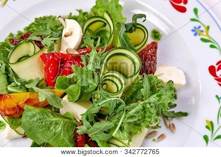 zucchini rolls with fresh salad