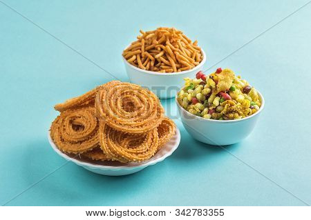 Indian Snack : Chakli, Chakali Or Murukku And Besan (gram Flour) Sev And Chivada Or Chiwada On Blue