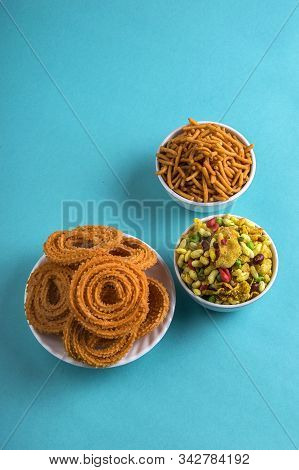Indian Snack : Chakli, Chakali Or Murukku And Besan (gram Flour) Sev And Chivada Or Chiwada On Blue
