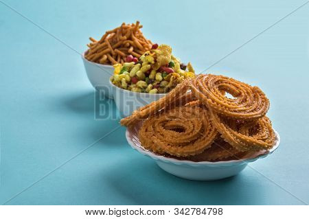 Indian Snack : Chakli, Chakali Or Murukku And Besan (gram Flour) Sev And Chivada Or Chiwada On Blue