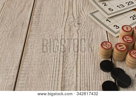 Play Bingo Or Lotto On A Wooden Table. Concept Of Board Games