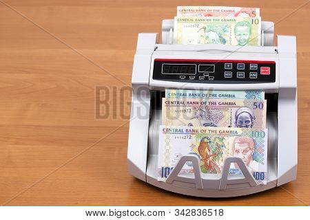 Old Gambian Money - Dalasi In A Counting Machine