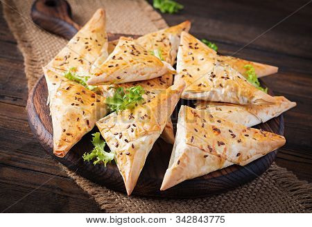 Asian Food. Samsa (samosas) With Chicken Fillet And Cheese On Wooden Background.