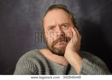 Portrait Of A 50 Years Old Man With A Mustache.  Emotions Of Fear And Horror.