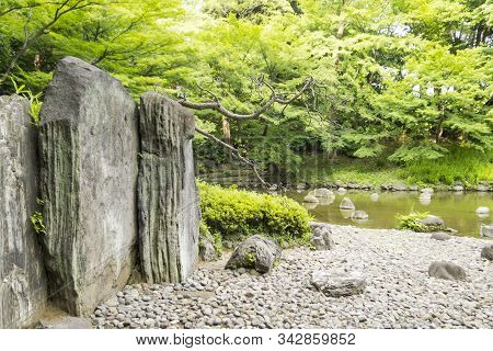 Walls Of Rocks And Gravel By River Of Koishikawa Korakuen Gardens In Tokyo