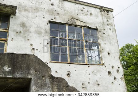 Wall Of Old Power Station Riddled With Rifle Shots
