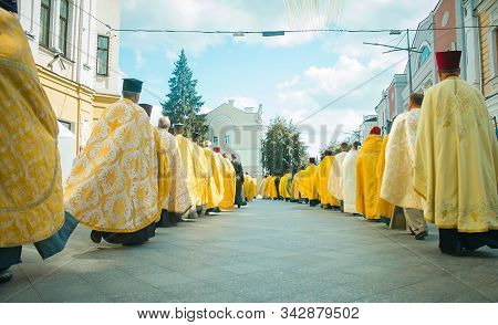 Religious Procession, Priests In Golden Robes Walk Along The Central Street At Zhytomyr, Ukraine