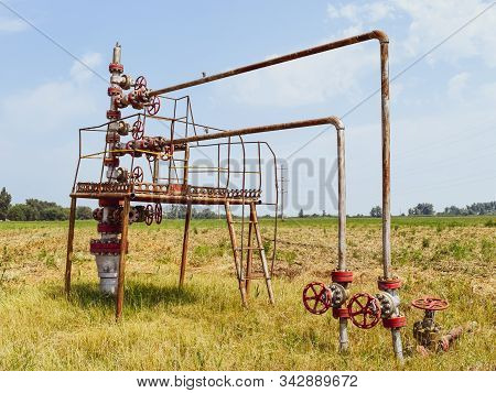 Well For Oil And Gas Production. Oil Well Wellhead Equipment. Oil Production.