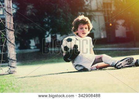 Childrens Soccer Football - A Match Of Young Children On The Football Field