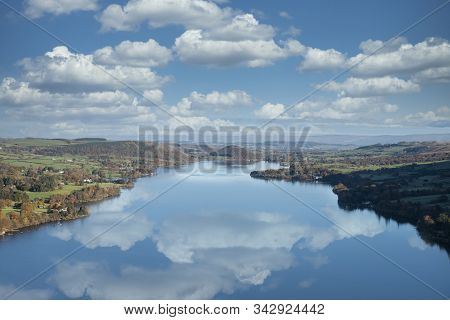 Epic Autumn Fall Landscape Of Ullswater And Surrounding Mountains And Hills Viewed From Hallin Fell 