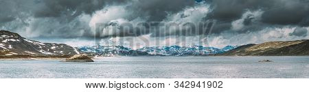 Oppland, Tyin Lake, Norway. Stones On Coast Of Beautiful Lake Tyin In Summer Cloudy Day. Norwegian N