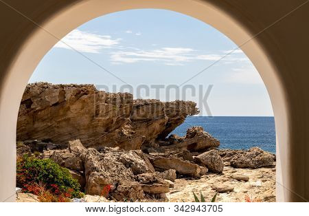 View Out Of An Archway At The Rocky Coastline At Kallithea Therms, Kallithea Spring On Rhodes Island
