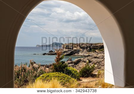 View Out Of An Archway At The Rocky Coastline At Kallithea Therms, Kallithea Spring On Rhodes Island