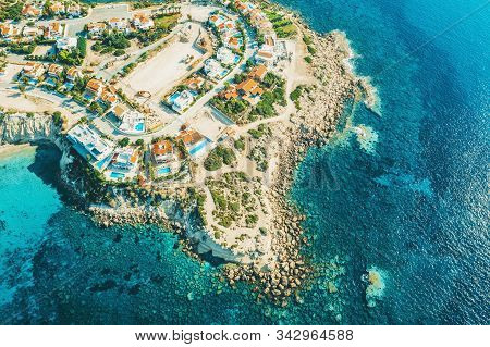 Aerial View Of Cyprus Island Coast With Villas For Rent And Rest And Blue Mediterranean Sea, Drone P