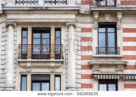 Facade Of A Historic Brick Building With Metal Balconies. Geneva, Switzerland - Image
