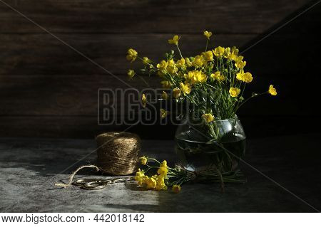 Still Life With Yellow Flowers And Wooden Background