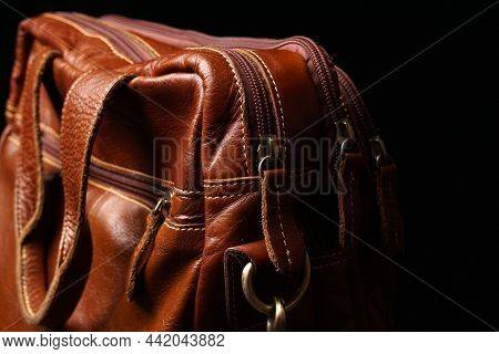 Men\'s Bag Made Of Genuine Orange Leather On A Dark Background