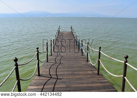 Front View Of A Wooden Pier On Lake Chapala, Jalisco Mexico