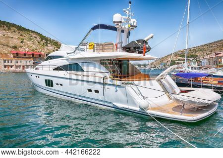 View Of Balaklava Bay With Yachts On Embankment Of Balaklava In Sevastopol City. Yachts And Boats Mo