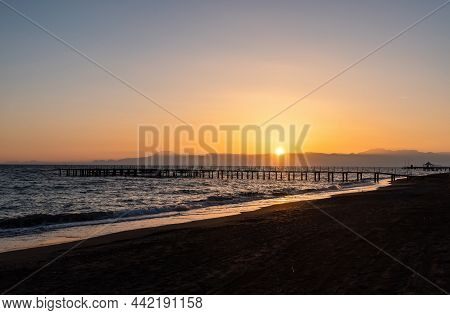 Sunset On Mediterranean Beach In Belek Resort Town Of Antalya Province In Turkey