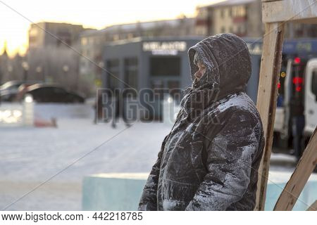 A Portrait Of A Fitter With A Hood On His Head