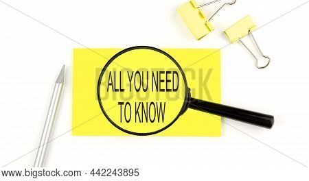 All You Need To Know Text On The Sticker Through Magnifier. View From Above. Business